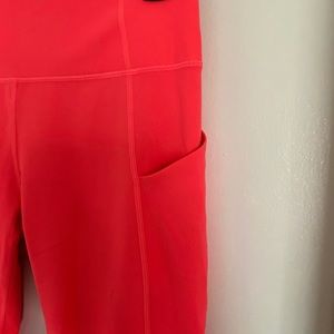 Pink Fabletics capri pocket leggings.